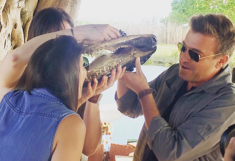 Jack holds the alligator's jaw as whiskey trickles through its teeth on Booze Traveler