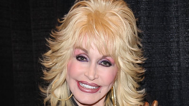 National Enquirer Investigates Dolly parton, pictured here at an award ceremony