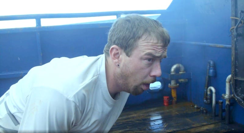 Saga deckhand Hannes Huswick wretches violently after inhaling smoke on this week's Deadliest Catch