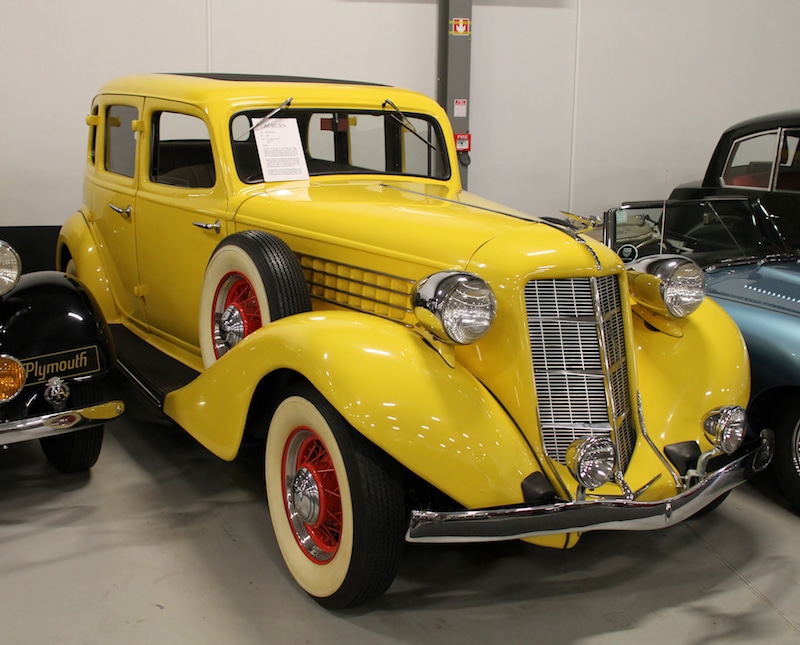 A yellow 1936 Auburn Model 653, similar to the car restored on American Pickers