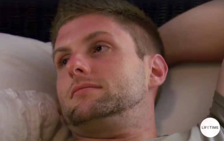 Close-up shot of Cody's head from Married at First Sight as he lies in bed staring into space