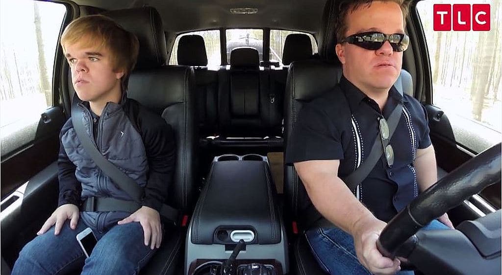 Trent and his son driving to their surprise party