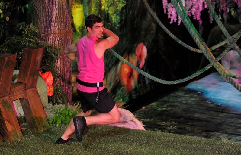 Cody swinging from vines in the Big Brother house
