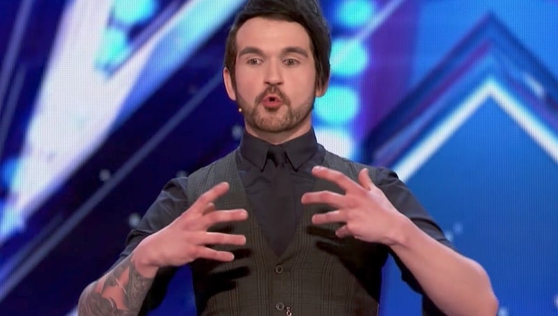 Colin Cloud talking on stage during his America's Got Talent audition