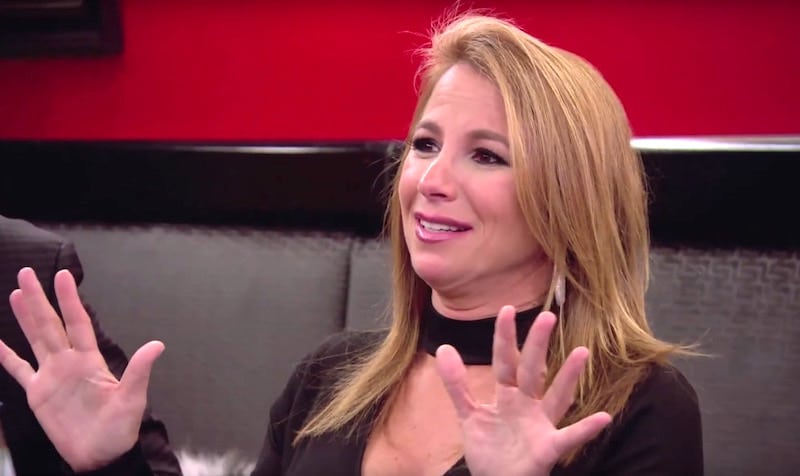 Jill Zarin gesticulating at a lunch table on The Real Housewives of New York City