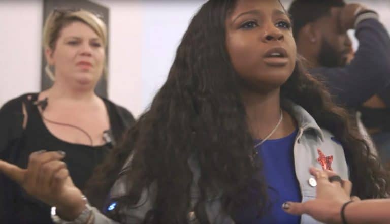 And angry looking Reginae Carter pointing at Brandon Barnes off screen on Love and Hip Hop: Atlanta