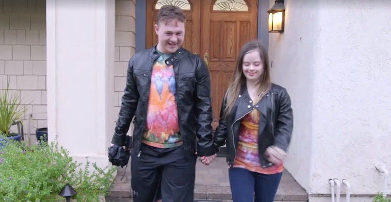 Steven and Megan holding hands as they walk away from a property on Born This Way