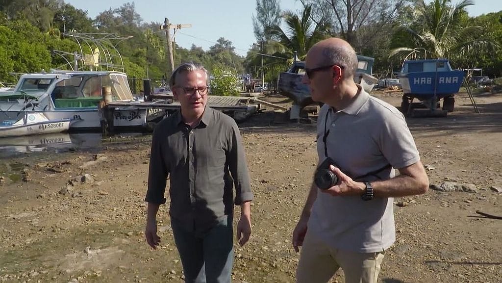 PBS host Geoffrey Baer and Hugo Perez walking together