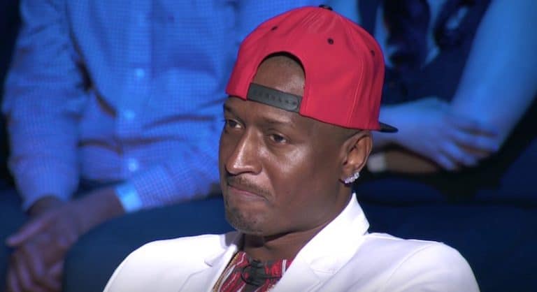 Kirk Frost in a red cap and white jacket on the Love & Hip Hop Atlanta reunion