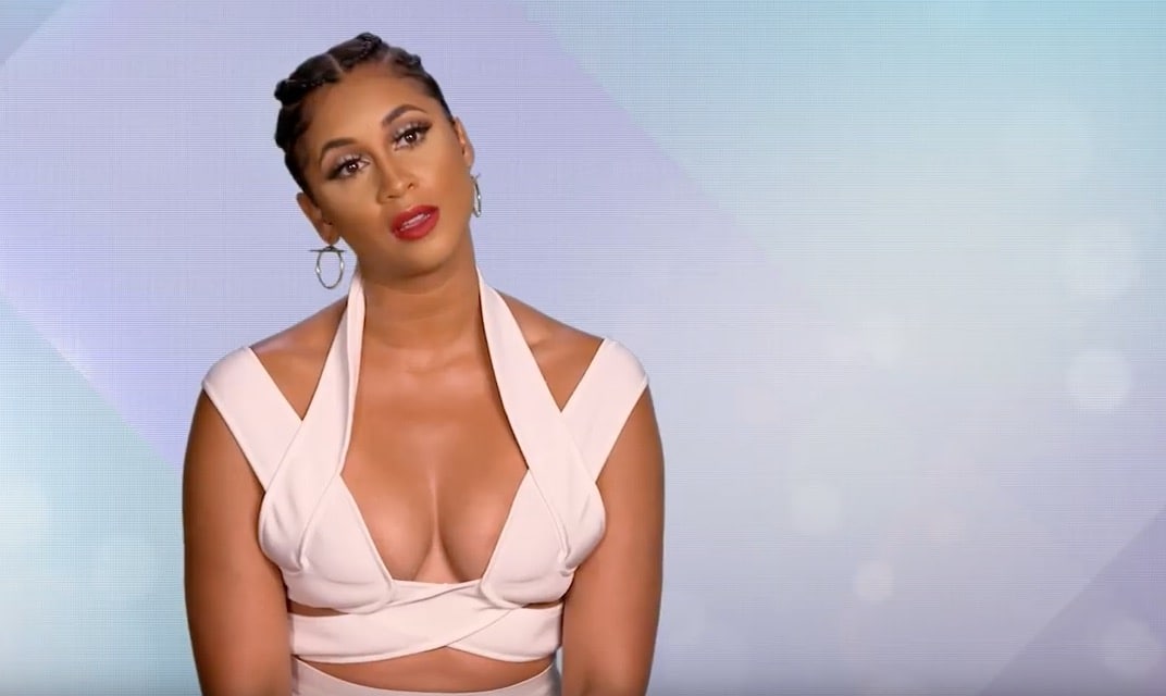 Darnell Nicole in a white dress talks to camera on WAGS Miami