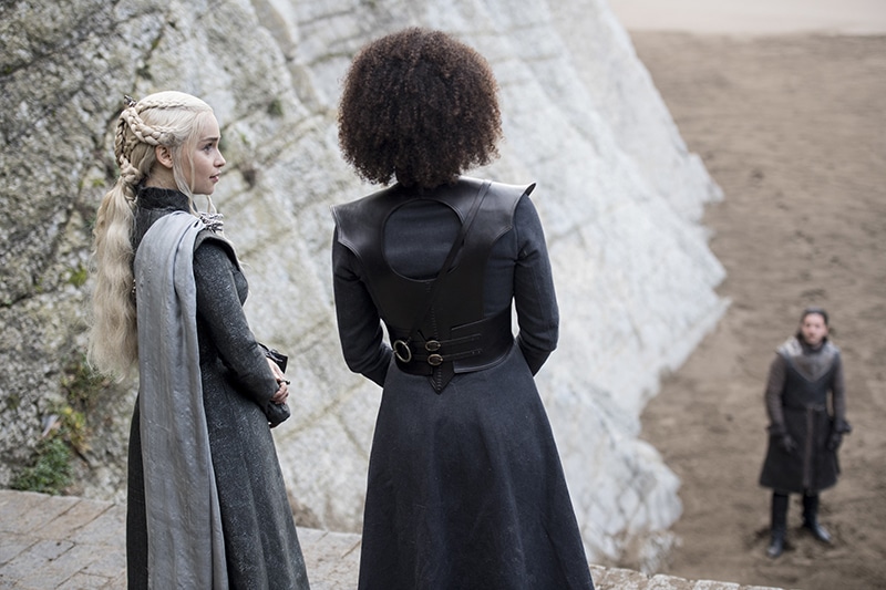 Daenerys and Missandei looking to Jon Snow.