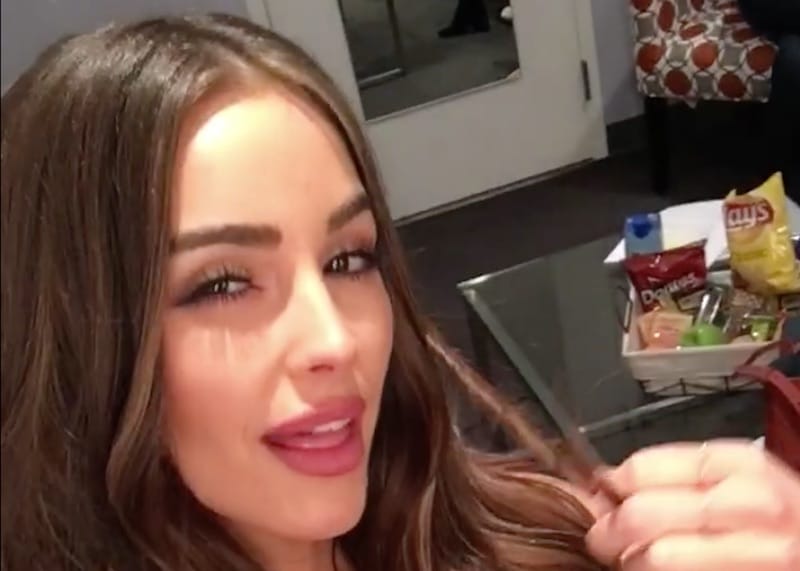 Olivia Culpo twirling her hair in a video talking about her To Tell The Truth appearance