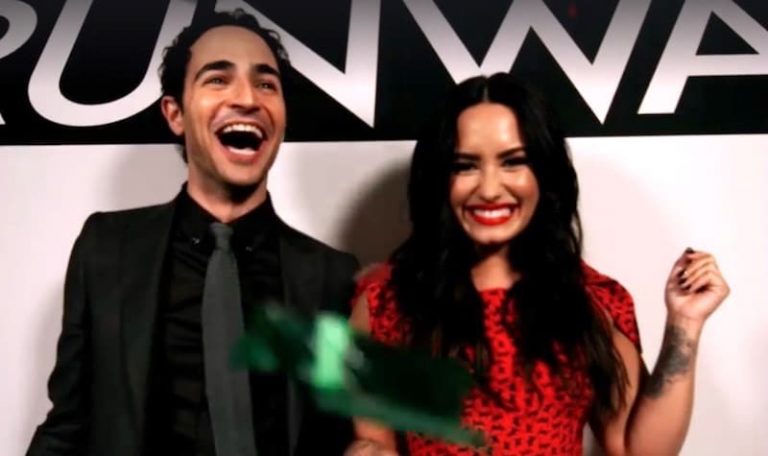 Zac Posen and Demi Lovato in a still from a Project Runway clip
