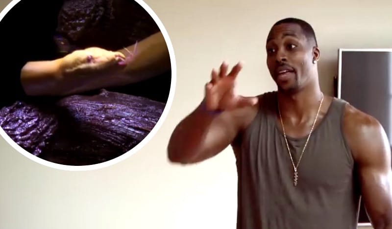 Dwight Howard and one of his snakes on Tanked