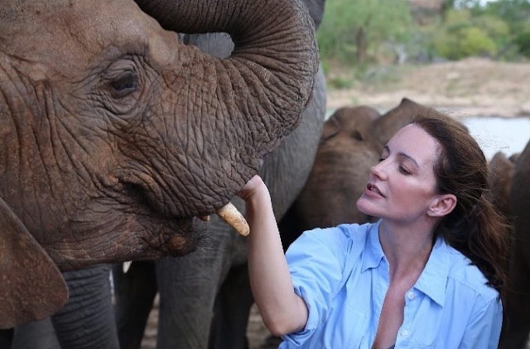 Kristin Davis with an orphaned elephant