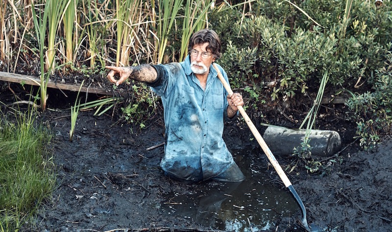Rick Lagina in the swamp in a promotional photo for The Curse of Oak Island Season 5