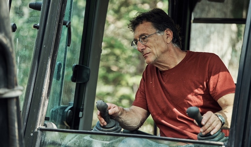 Marty Lagina in excavator on The Curse of Oak Island