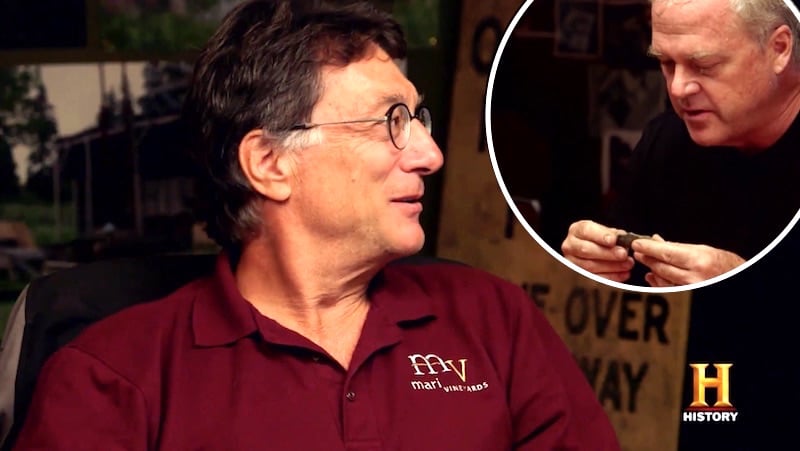 Marty Lagina and Laird Niven examining apparent bone on The Curse of Oak Island