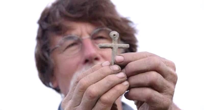 Rick Lagina holding a cross on The Curse of Oak Island