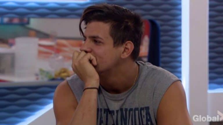 Faysal looking confused in the Big Brother kitchen