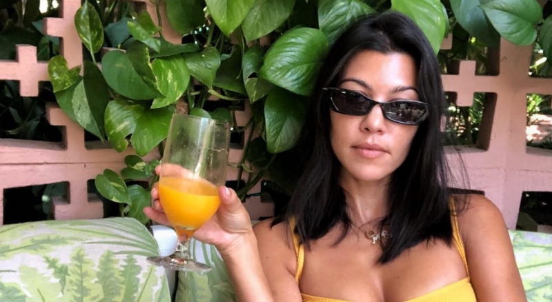 Kourtney Kardashian drinking orange juice