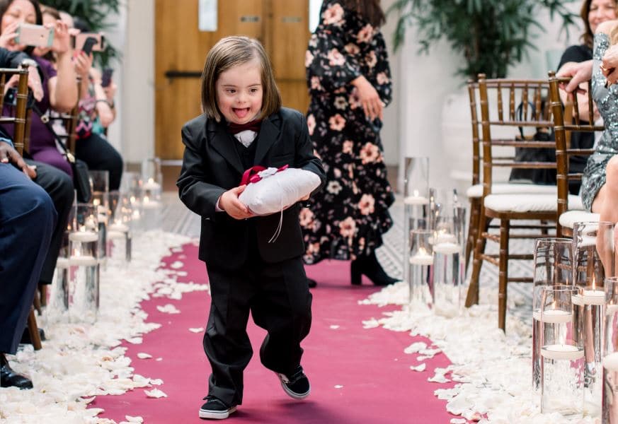 Rocco is beaming as he is assigned to be the ring bearer at Cristina and Angel's wedding