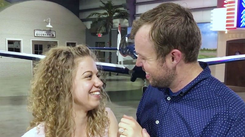 John David Duggar and Abbie Burnett after their engagement in an airplane hanger