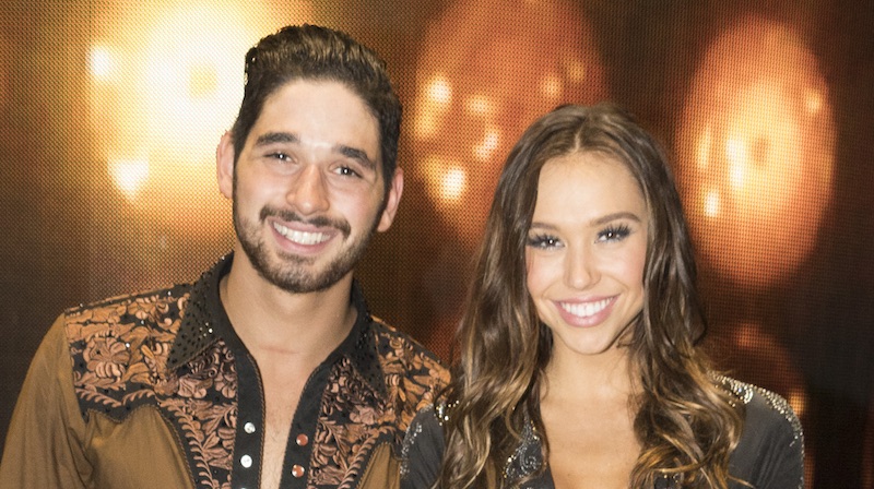 Alan Bersten and Alexis Ren posing backstage on Dancing with the Stars