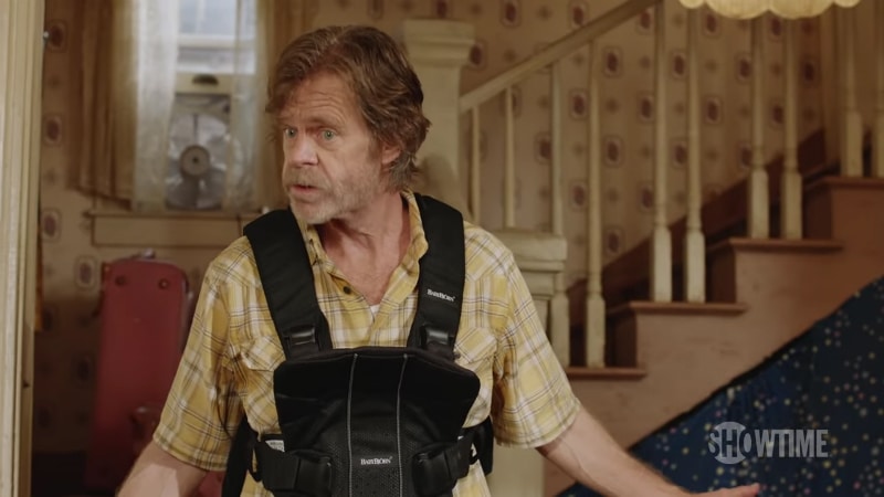 Frank Gallagher wears a baby carrier on Shameless