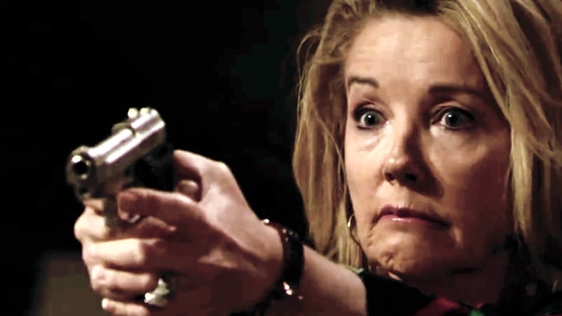 Nikki points her gun just before firing on The Young and the Restless
