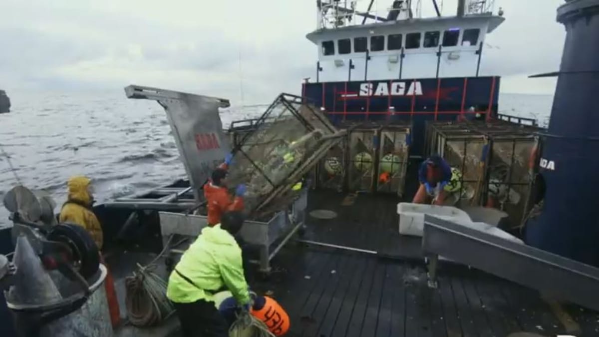 The moment the metal pot springs from its unsecured locking device and falls towards the men on deck. ic credit: Discovery