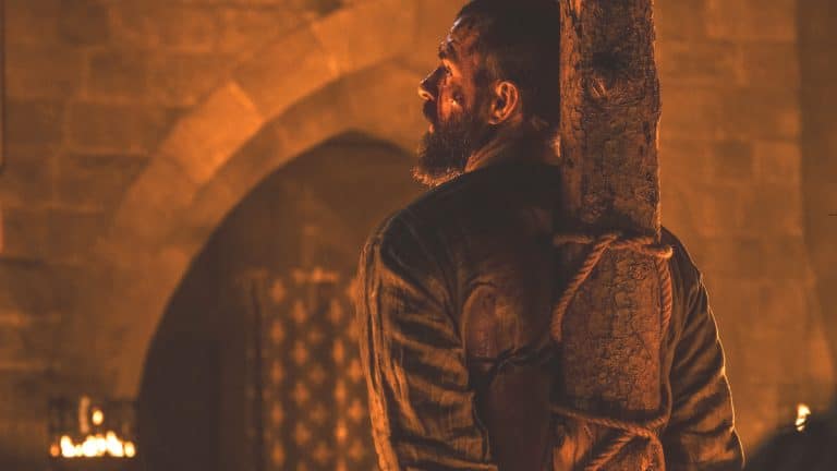 Landry is tied to the stake in Episode 8 of Knightfall Season 2