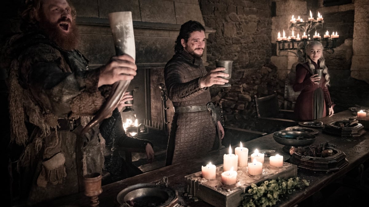 Jon Snow raises his cup, which is clearly not the Starbucks cup.