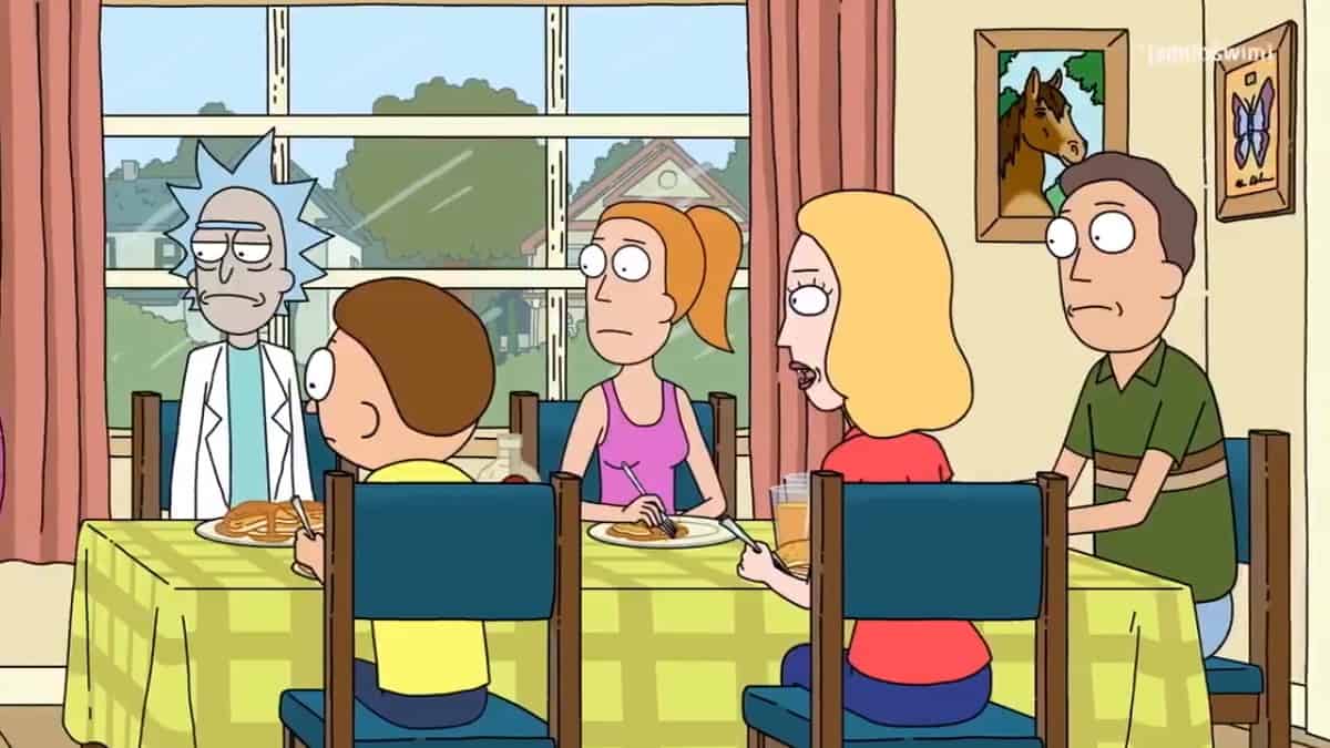 Rick and Morty and the rest of the family sit at the dinner table