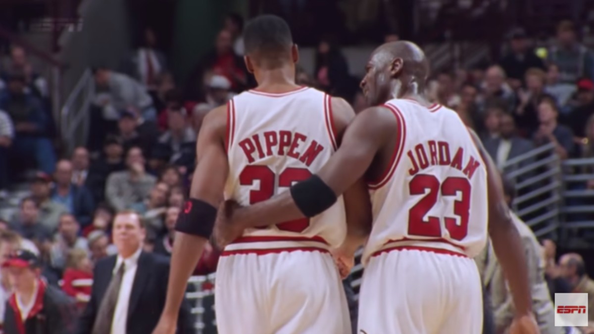 Pippen and Jordan share an embrace on the court