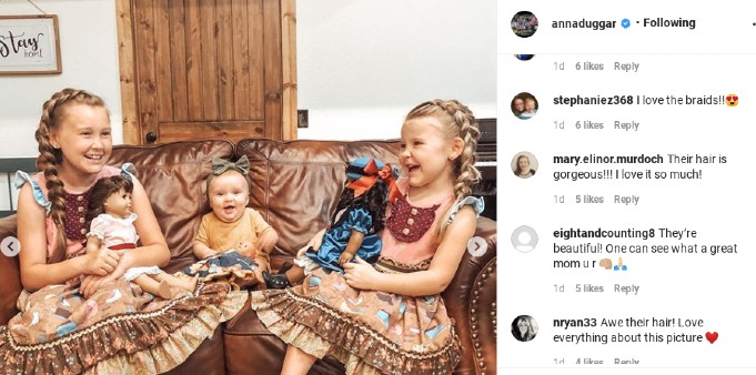 Anna Duggar's daughters with their dolls.