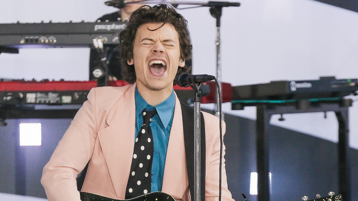Harry Styles performing on-stage