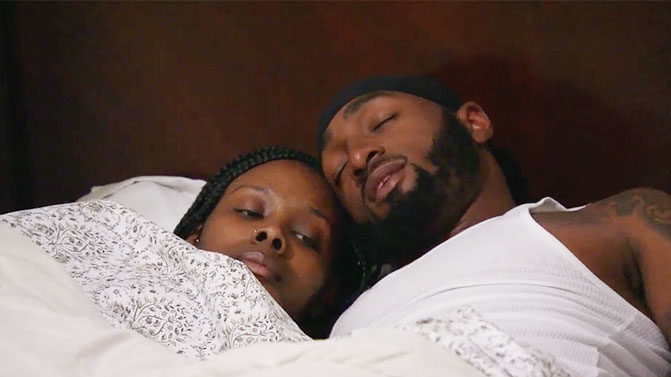 MAFS couple Woody and Amani laying in bed together