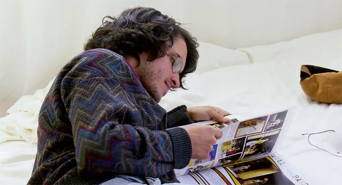 MAFS Season 11 Bennett looking at Amelia's yearbook on the bed