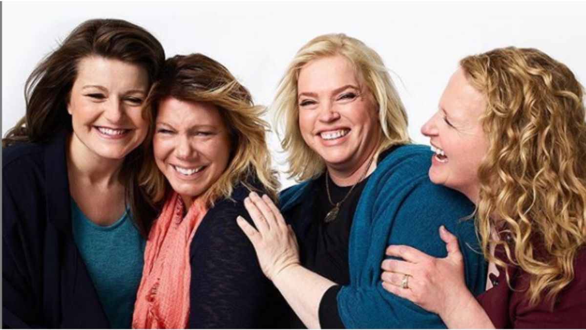 The Sister Wives hugging and smiling together