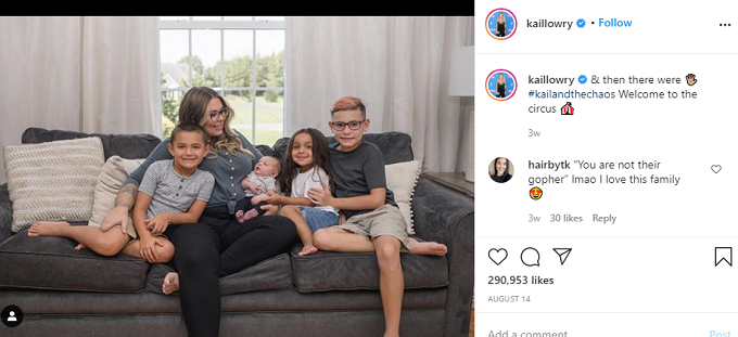 Kailyn Lowry sitting on a couch with her four boys