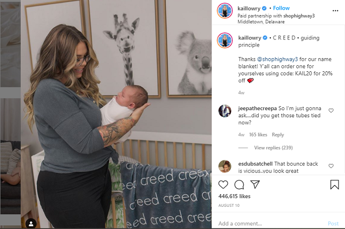 Kailyn Lowry holding baby Creed in his nursery