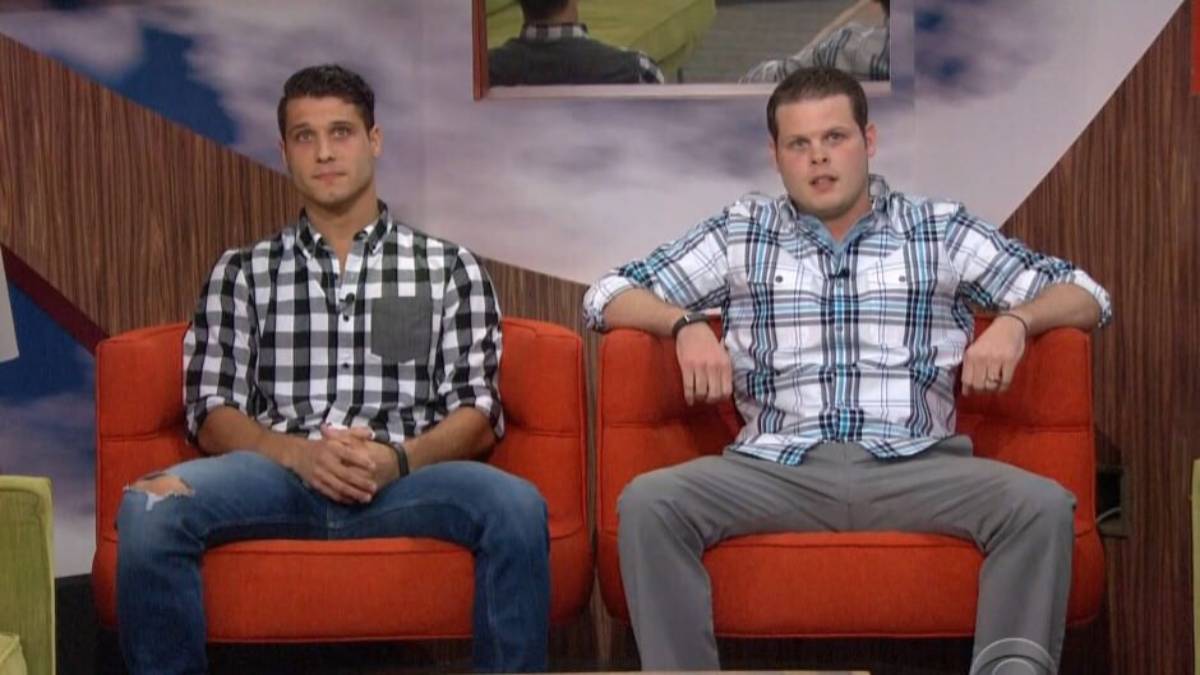 Cody Calfiore and Derrick Levasseur sit in big red chairs.
