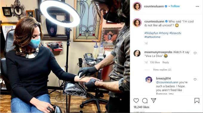 Luann de Lesseps gets her arm cleaned for a tattoo.