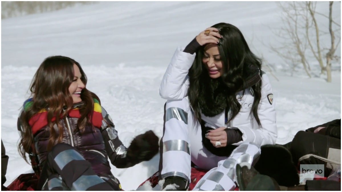 RHOSLC stars Lisa Barlow and Jen Shah taking a break after snowmobiling.