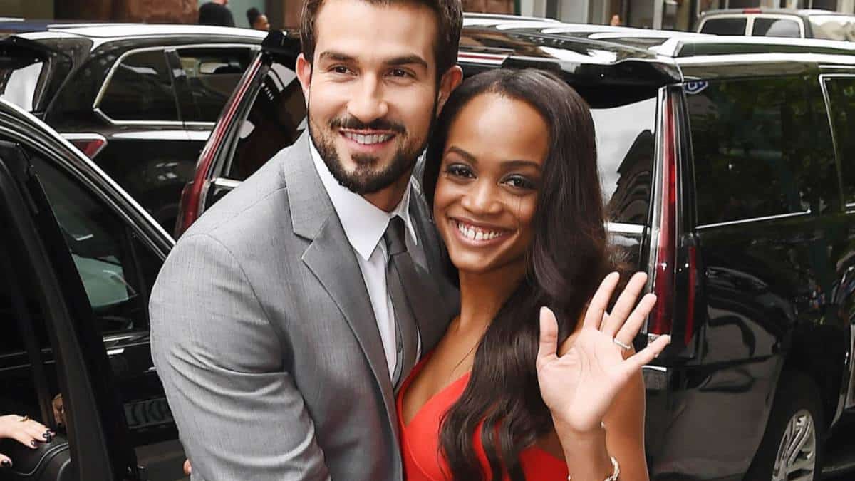 Rachel Lindsay and Brian Abasolo pose on the street for pictures