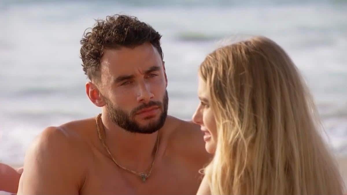 Brendan Morais stares at Demi Burnett on the beach