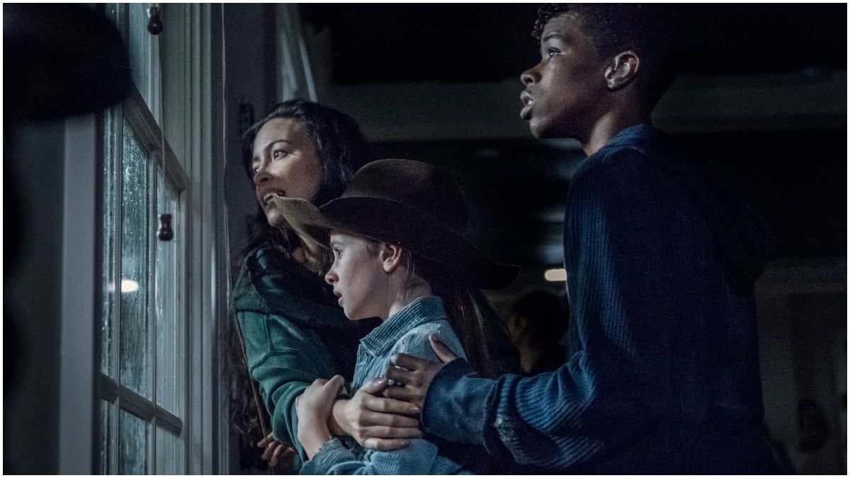 Christian Serratos as Rosita, Cailey Fleming as Judith, and Angel Theory as Kelly, as seen in Episode 8 of AMC's The Walking Dead Season 11