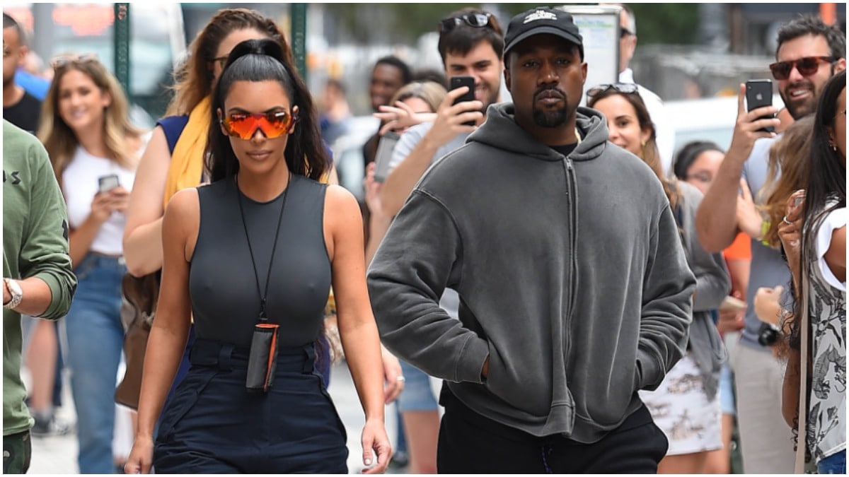 Kim Kardashian and Kanye West walking down the street in New York City.