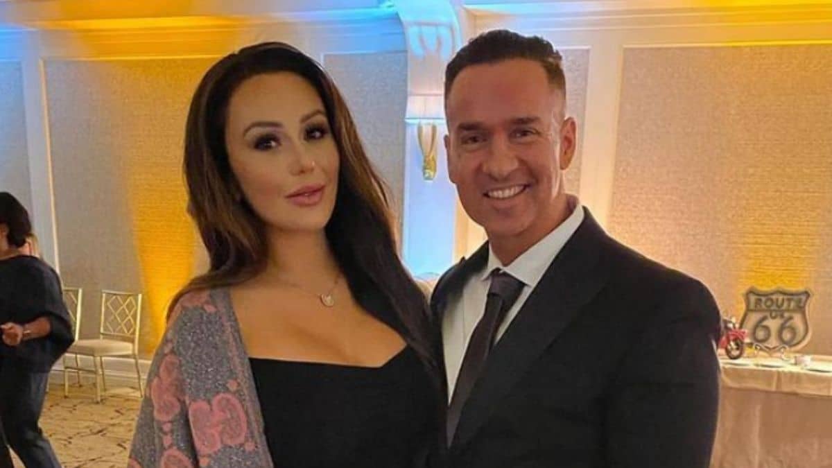Jenni Farley and Mike Sorrentino dressed in fancy clothes at a wedding